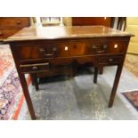 A 19th C. MAHOGANY SIDE TABLE, THE RECTANGULAR TOP OVER A LONG DRAWER AND TWO SHORT DRAWERS FLANKING