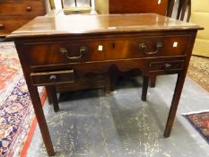 A 19th C. MAHOGANY SIDE TABLE, THE RECTANGULAR TOP OVER A LONG DRAWER AND TWO SHORT DRAWERS FLANKING
