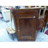 A GEORGE III OAK AND EBONY INLAID CORNER CABINET.