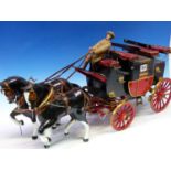 A HAND BUILT MODEL OF A VICTORIAN STAGECOACH CARRIAGE WITH TWO HORSE TEAM AND DRIVER. APPROX