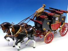 A HAND BUILT MODEL OF A VICTORIAN STAGECOACH CARRIAGE WITH TWO HORSE TEAM AND DRIVER. APPROX