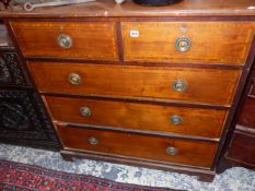 AN EDWARDIAN MAHOGANY AND SATIN WOOD BANDED CHEST OF DRAWERS.