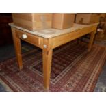 A PINE SCULLERY TABLE WITH END DRAWER.