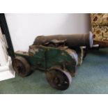 A PAIR OF ANTIQUE CANNONS ON WOODEN CARRIAGES, THE BARRELS. W 72cms. THE BARREL MOUTH. Dia. 5.5cms.