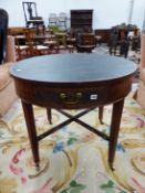 A GEORGIAN AND LATER MAHOGANY DRUM TOP LIBRARY TABLE ON SQUARE LEGS UNITED BY PIERCED STRETCHER.