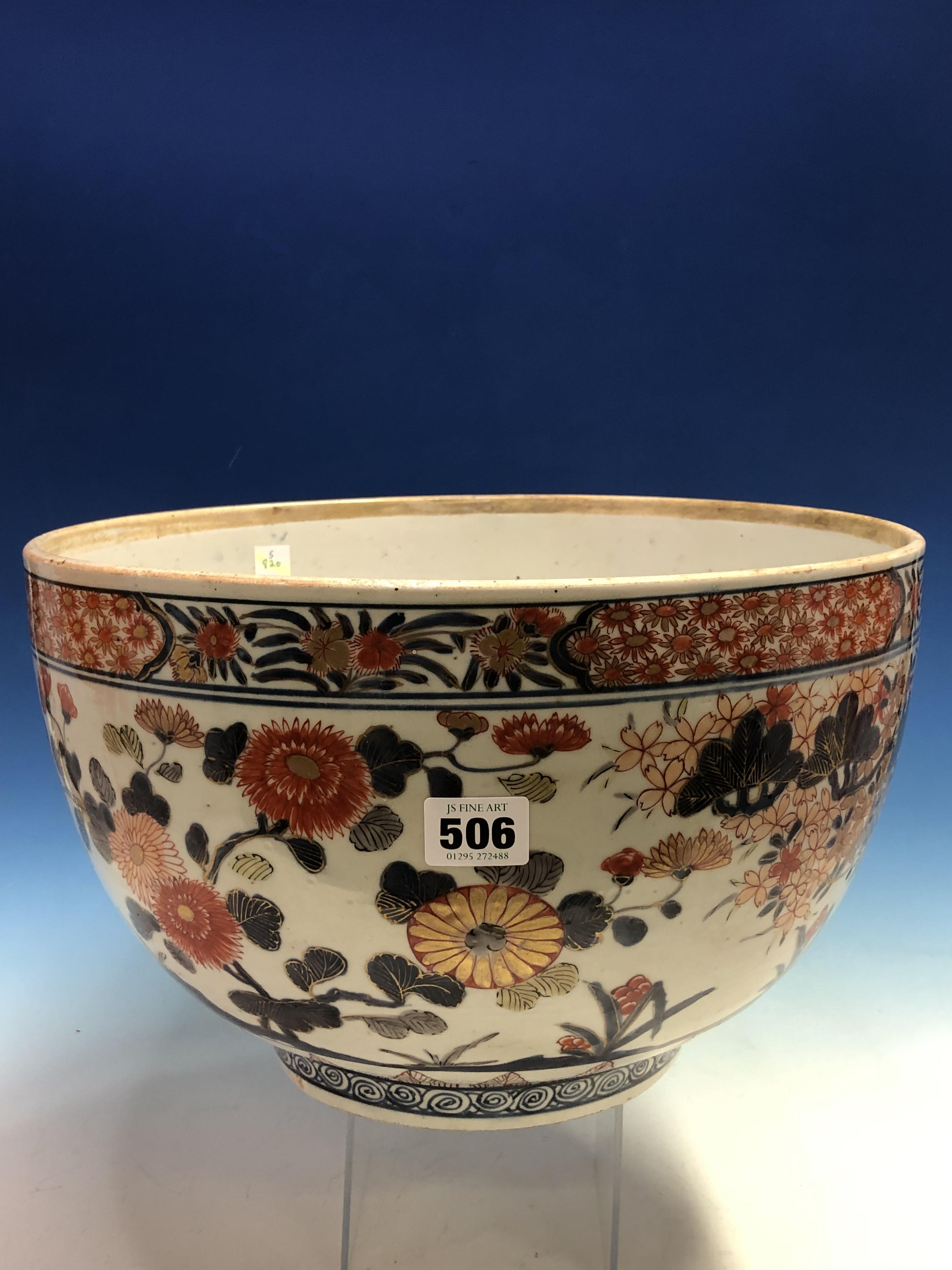 AN 18th C. JAPANESE IMARI BOWL, THE EXTERIOR PAINTED WITH FLOWERING CHERRY AND WITH CHRYSANTHEMUMS