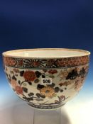 AN 18th C. JAPANESE IMARI BOWL, THE EXTERIOR PAINTED WITH FLOWERING CHERRY AND WITH CHRYSANTHEMUMS