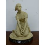 R CHAPU, AN EARLY 20th C. CREAM PAINTED TERRACOTTA FIGURE OF A SEATED LADY, BELIEVED TO JOAN OF ARC,
