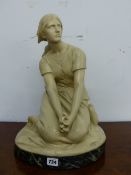 R CHAPU, AN EARLY 20th C. CREAM PAINTED TERRACOTTA FIGURE OF A SEATED LADY, BELIEVED TO JOAN OF ARC,