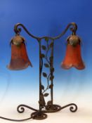 AN EDGAR BRANDT STYLE WROUGHT IRON TABLE LAMP SUPPORTING TO DAUM LIKE PURPLE FLECKED RED GLASS