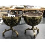 A PAIR OF ANTIQUE COCONUT AND BRASS, INLAID THREE FOOTED BOWLS.