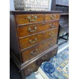 AN 18th C. WALNUT CHEST ON STAND, THE TOP WITH TWO SHORT AND THREE GRADED LONG DRAWERS ON PLINTH