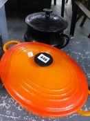 A LE CREUSET CASSEROLE DISH WITH LID, AND A POTTERY EXAMPLE.