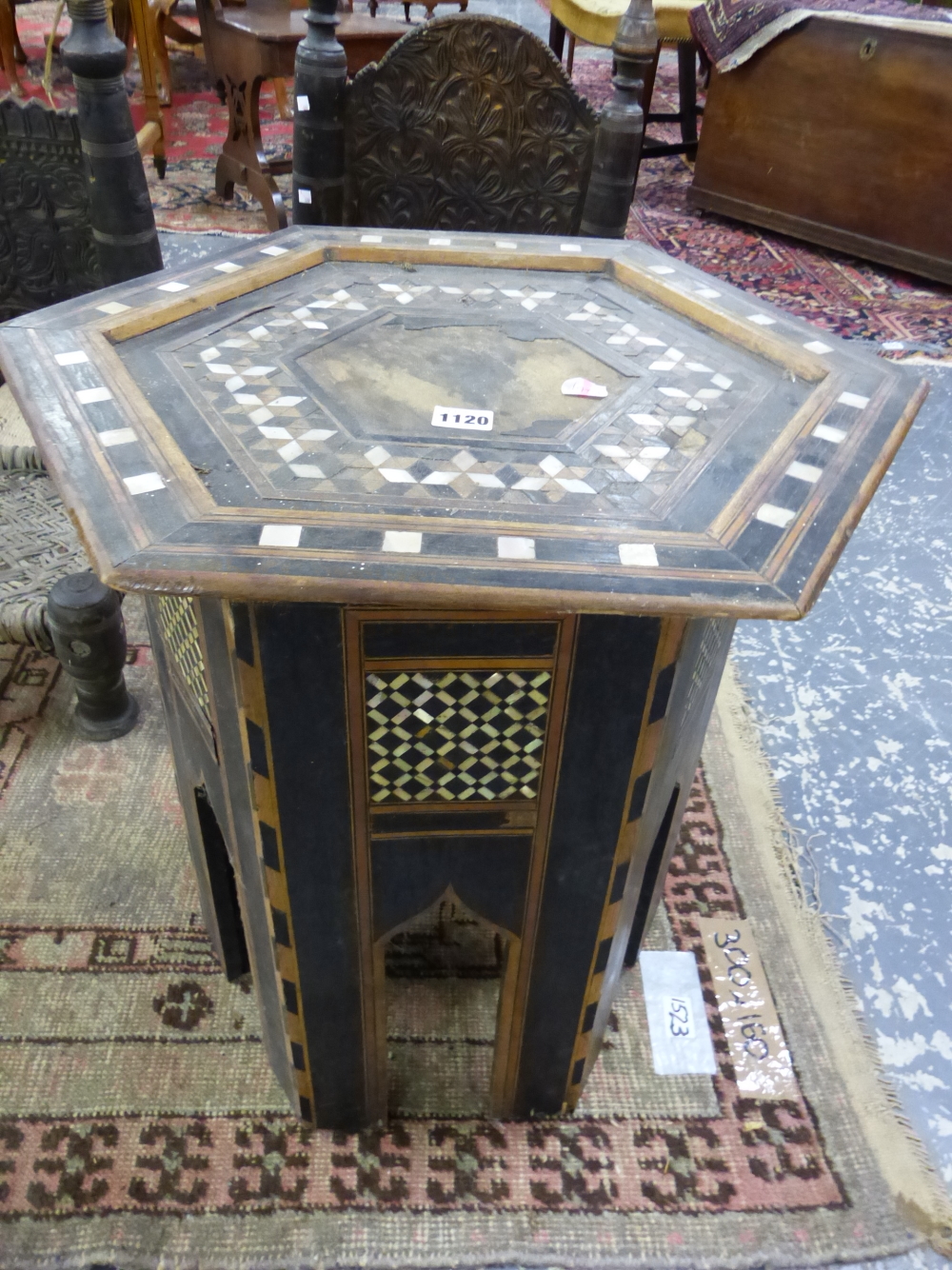 AN ISLAMIC HEXAGONAL TABLE GEOMETRICALLY INLAID IN MOTHER OF PEARL AND EBONY, DIAMOND DIAPER