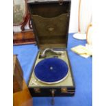 A VINTAGE PORTABLE GRAMOPHONE, A FRUIT PRESS AND A STOOL.