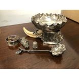 A HALLMARKED SILVER DISH SUPPORTED ON LEAF STAND WITH BOAR'S TUSK, A SIFTER, A THIMBLE, A TRINKET BO
