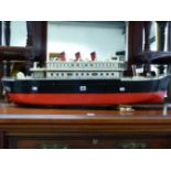 A SCALE MODEL PASSENGER SHIP MODEL, THREE CHIMNEYS ABOVE THE UPPER OF TWO DECKS, PORT HOLES IN THE