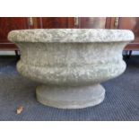 AN ANTIQUE CARVED WHITE MARBLE OVAL CISTERN, THE ROLLED RIM ABOVE A HALF ROUND BAND AND THE RECESSED