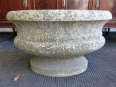 AN ANTIQUE CARVED WHITE MARBLE OVAL CISTERN, THE ROLLED RIM ABOVE A HALF ROUND BAND AND THE RECESSED