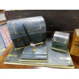 A GREEN LEATHER DESK SET WITH GILT DETAILS, COMPRISING: BLOTTER, STRING DISPENSER, SCISSORS,