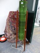 A 20th C. FLOOR STANDING "ROCKET" LAMP, THE CYLINDRICAL GREEN SHADE SUPPORTED BY THREE MAHOGANY