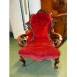 A CARVED MAHOGANY VICTORIAN SHOW FRAME ARMCHAIR