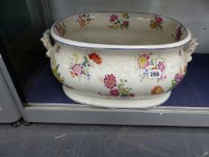 AN ANTIQUE POTTERY FOOT BATH