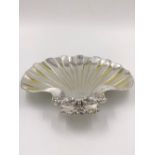 A VICTORIAN HALLMARKED SILVER THREE FOOTED SHELL FORM DISH DATED 1895 LONDON FOR W & C SISSONS.