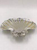 A VICTORIAN HALLMARKED SILVER THREE FOOTED SHELL FORM DISH DATED 1895 LONDON FOR W & C SISSONS.