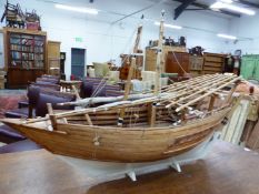 A VINTAGE SCRATCH BUILT MODEL OF A MIDDLE EASTERN SAILING BOAT, FLYING THE FLAG OF UNITED ARAB