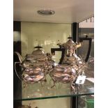 A HALLMARKED SILVER FOUR PIECE COFFEE AND TEASET COMPRISING OF A TEAPOT, COFFEE POT, SUGAR BASIN AND