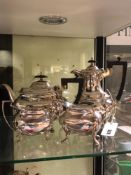 A HALLMARKED SILVER FOUR PIECE COFFEE AND TEASET COMPRISING OF A TEAPOT, COFFEE POT, SUGAR BASIN AND