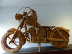 A BASKET WORK SCALE MODEL OF A HARLEY DAVIDSON, THE MOTORBIKE WITH BENT WOOD FRAME