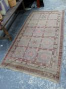 AN ANTIQUE KHOTAN RUG, 300 X 160cms