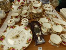 A OLD COUNTRY ROSES ROYAL ALBERT PART TEA AND DINNER SERVICE, TO INCLUDE A CLOCK AND FRAME, ETC