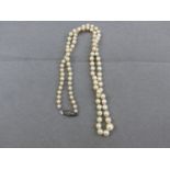 A ROW OF GRADUATED PEARLS WITH A SILVER AND MARCASITE CLASP
