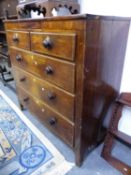 AN EARLY 19th C. OAK CHEST OF TWO SHORT AND THREE GRADED LONG DRAWERS, THE WAVY APRON RUNNING INTO