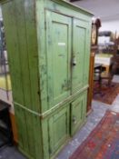 A 19th C. GREEN PAINTED PINE FLOOR STANDING CUPBOARD, THE TWO PAIRS OF DOORS ENCLOSING SHELVES. W