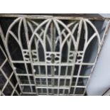 FIVE GLAZED IRON WINDOW FRAMES, EACH WITH TRIPLE GOTHIC ARCHED TOP VENTRED BY A QUATREFOIL. 103.5
