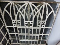 FIVE GLAZED IRON WINDOW FRAMES, EACH WITH TRIPLE GOTHIC ARCHED TOP VENTRED BY A QUATREFOIL. 103.5