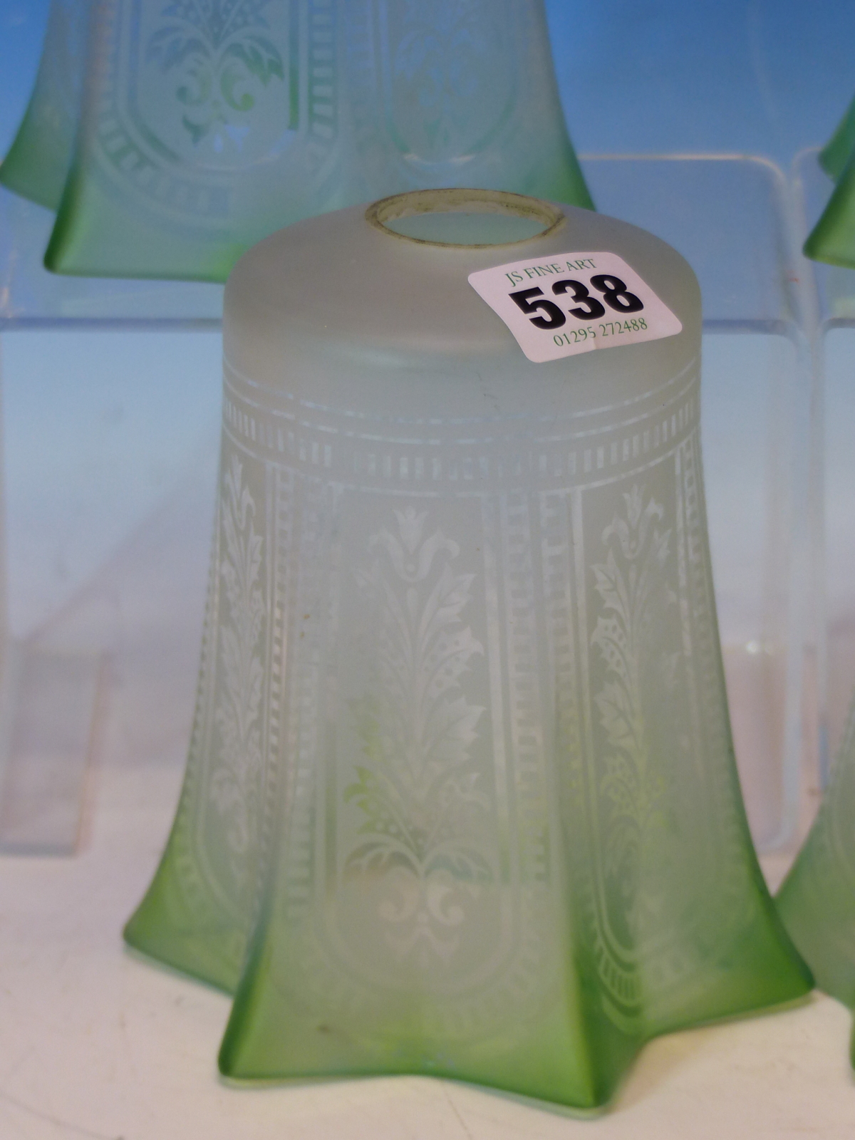 A SET OF FOUR ETCHED GLASS SHADES WITH GREEN TINTED HEXAFOIL RIMS. H 14cms. - Image 3 of 5