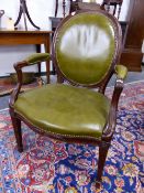 AN EARLY 19th C. MAHOGANY CHAIR, THE OVAL BACK, ELBOW RESTS AND SEAT CLOSE NAILED IN OLIVE GREEN