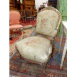 A 19th C. FRENCH GILT WOOD FAUTEUIL UPHOLSTERED IN FLORAL TAPESTRY, THE BACK CRESTED