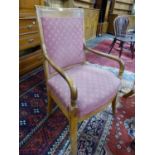 A 19th C. FRENCH FRUIT WOOD ELBOW CHAIR, THE SQUARE BACK AND SEAT UPHOLSTERED IN TERRACOTTA GROUND