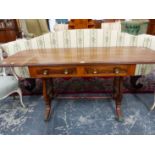 A ROSEWOOD LOW SOFA TABLE WITH LINE INLAID FLAPS, TWO DRAWERS TO ONE SIDE, THE LYRE SUPPORTS ON PAIR