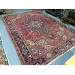 A PERSIAN HERIZ CARPET, 335 x 242cms