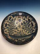 A BLUE AND WHITE MAIOLICA BOWL, POSSIBLY 17th C. TALAVERA, PAINTED WITH A STYLISED HOUSE BETWEEN TWO