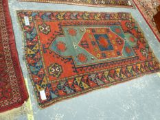 AN ANTIQUE CAUCASIAN KAZAK RUG, 210 x 136cms