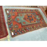 AN ANTIQUE CAUCASIAN KAZAK RUG, 210 x 136cms