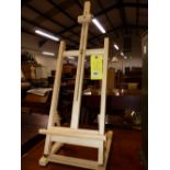 A SMALL TABLE TOP EASEL.
